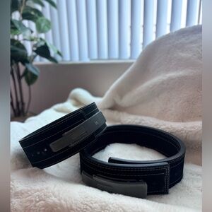 Inzer weight lifting belt one belt is a size Small other one is a Medium.